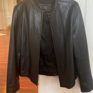 Size L black leather jacket with gold hardware.
